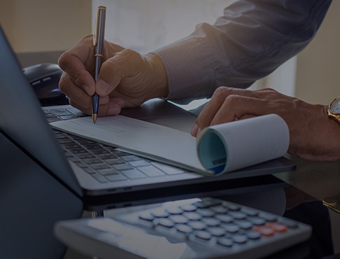 man writing a check